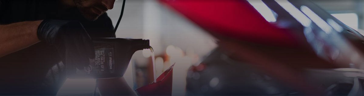  Technician pouring Oil